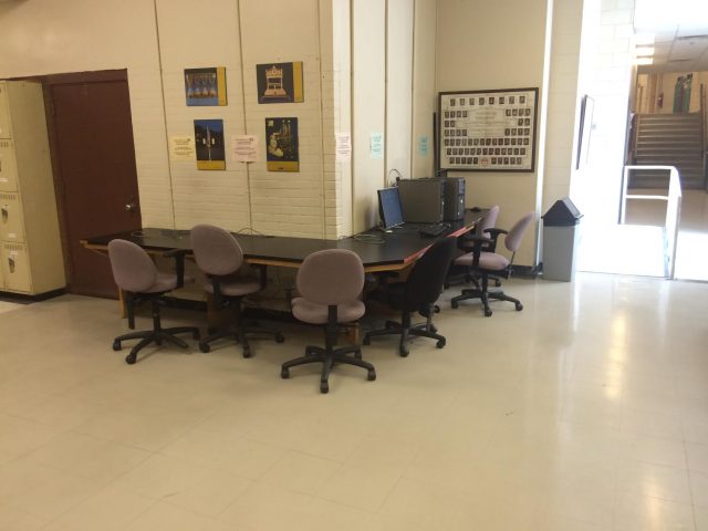 A table with a few chairs and a single computer is the only designated study space in a building that accommodates over 300 students.