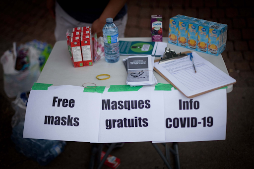 Immigrant Workers Centre weekly distribution of supplies and leaflets outside the Dollarama warehouse in Montreal